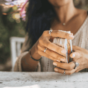 woman with tarot cards in hands